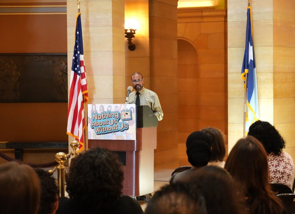 Dr. Robsan (Halkeno) Tura, assistant commissioner for the Health Improvement Bureau, speaks and recognizes CHWs.