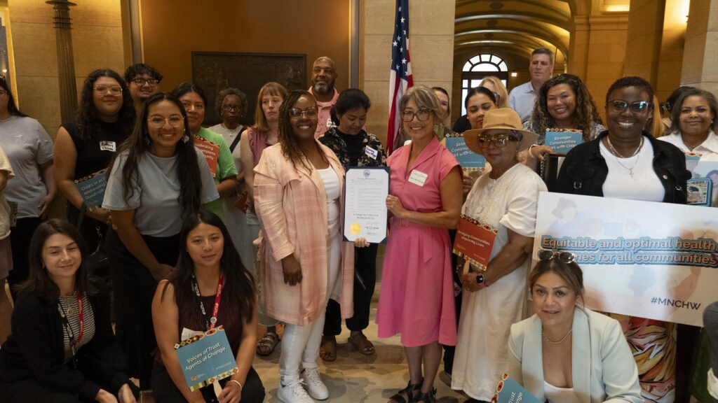 Community Health Workers (CHWs), healthcare leaders, policymakers, advocates, and allies together at the State Capitol for a group picture