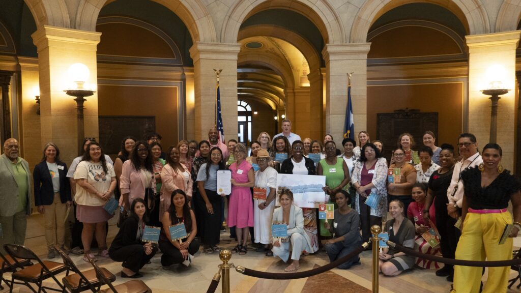 Community Health Workers (CHWs), healthcare leaders, policymakers, advocates, and allies together at the State Capitol for a group picture