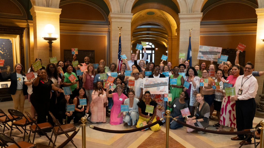 Community Health Workers (CHWs), healthcare leaders, policymakers, advocates, and allies together at the State Capitol for a group picture